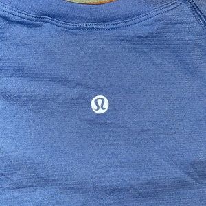 Lululemon blue athletic too with log in the fabric on front